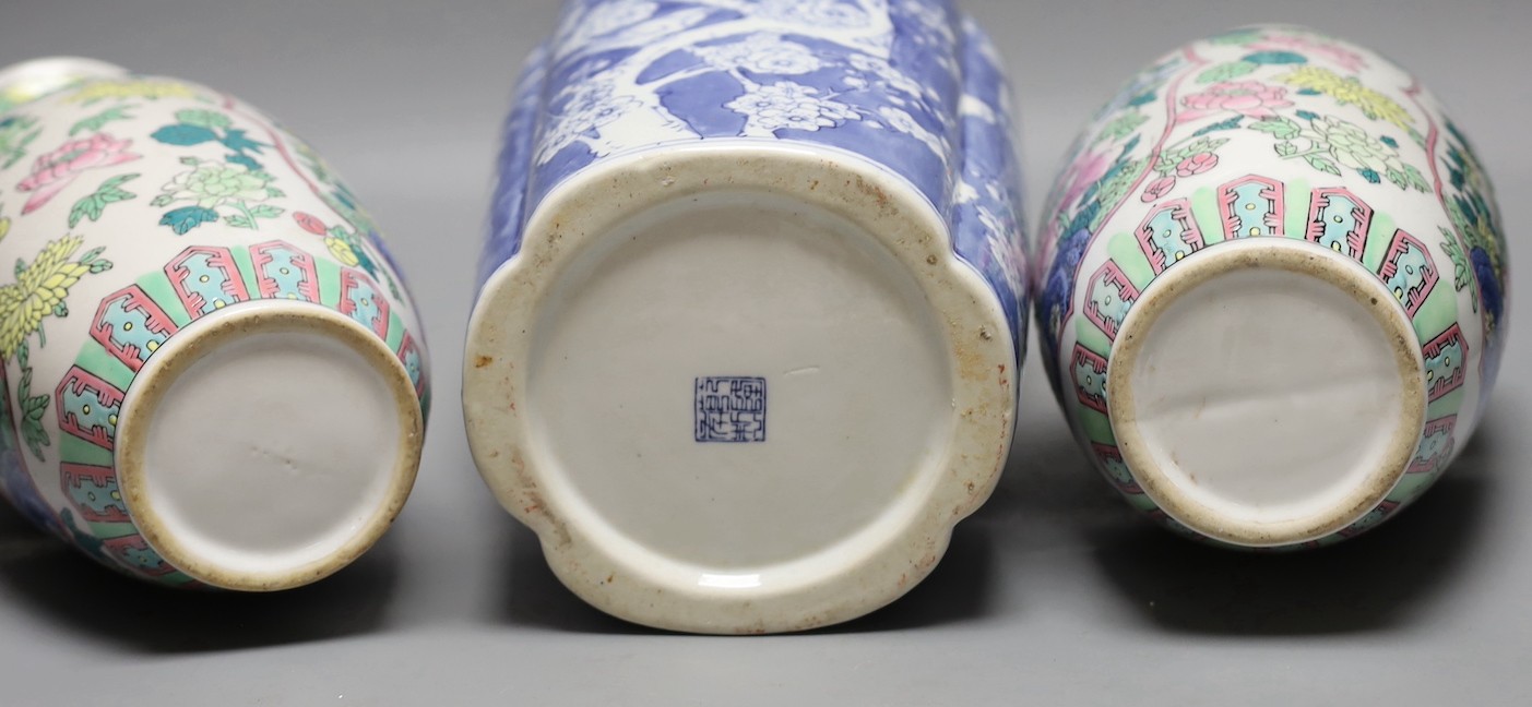 A pair of Chinese enamelled porcelain baluster vases and a Chinese blue and white vase. 37cm